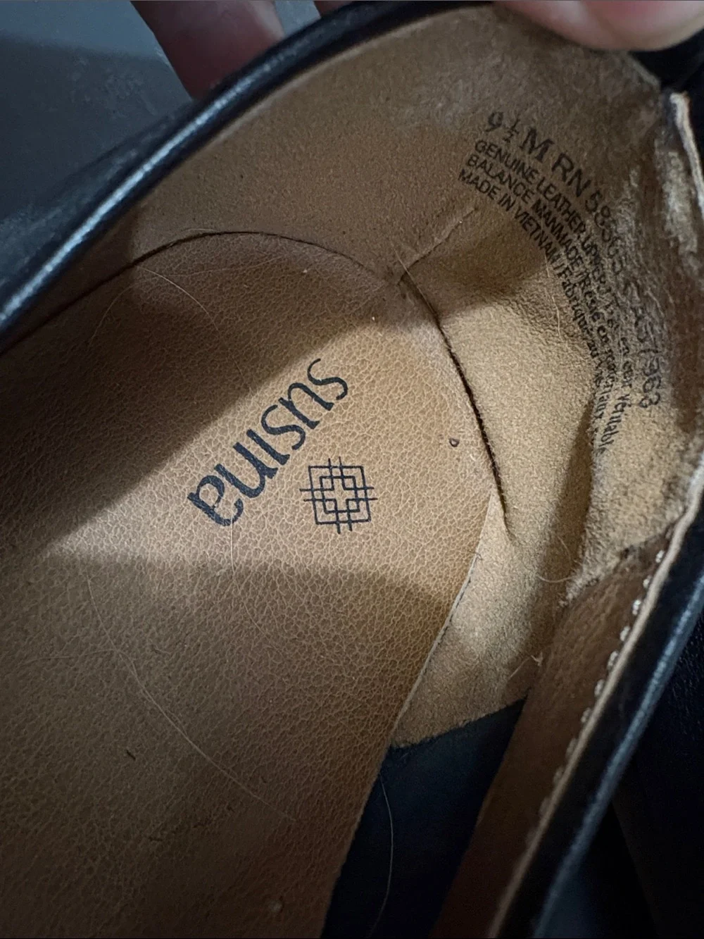 Susina Black Leather Slip-On Loafers with Brown Insole Trim